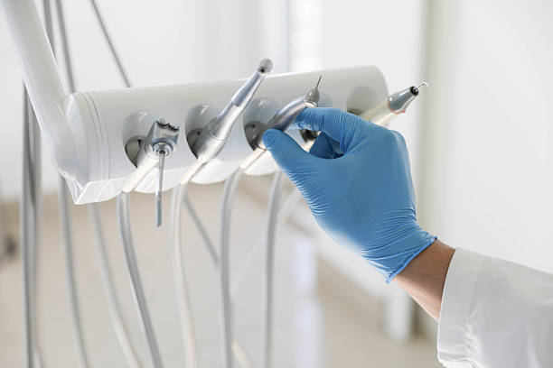 Professional Tooth Extraction technician working in Rossville, IL